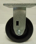 Heavy Duty Five By Two Inch Phenolic Casters Boasting A Rock Solid Kingpinless Build With Snappy Top Lock Brakes, close-up view.