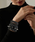 Set Of Four Badass Punk Studded Leather Bracelets For Men And Women Adjustable Spike Rock Goth Emo Y2K Grunge Wrist Cuffs on wrist.