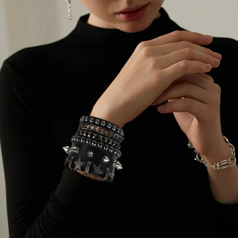 Set Of Four Badass Punk Studded Leather Bracelets For Men And Women Adjustable Spike Rock Goth Emo Y2K Grunge Wrist Cuffs on wrist.