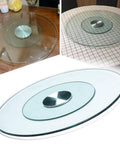 Top Shelf Tempered Glass Lazy Susan Turntable Featuring A Smooth As Butter 360 Degree Swivel Rotation on a dining table surface.
