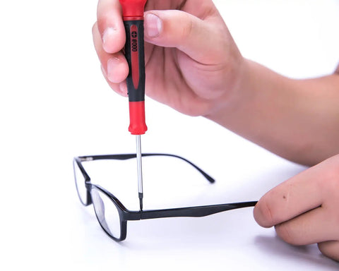 Adjusting glasses with Nine Piece Precision Screwdriver Set With Magnetic Tips And Swivel End Cap, ergonomic grip, chrome vanadium steel.
