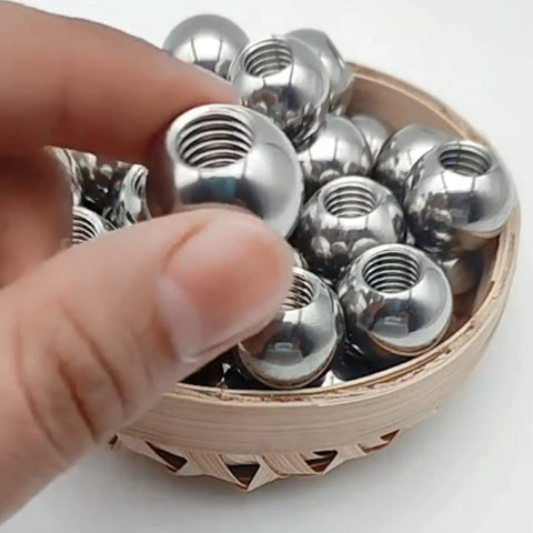 Stainless steel threaded piercing balls (M8) with internal threads, set of several, 15–60 mm, in wooden bowl