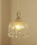 Top Shelf Vintage Crystal Pendant Light With Dope Diamond Cut Glass Shade And Legit Brass Accents Adjustable 0.5 To 70 Inch Cord hanging above illuminated interior.