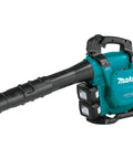 Game Changing Cordless Leaf Blower Kit Equipped With A Brushless Motor Pumping 473 CFM And 120 MPH Air with teal body and rapid swap batteries.