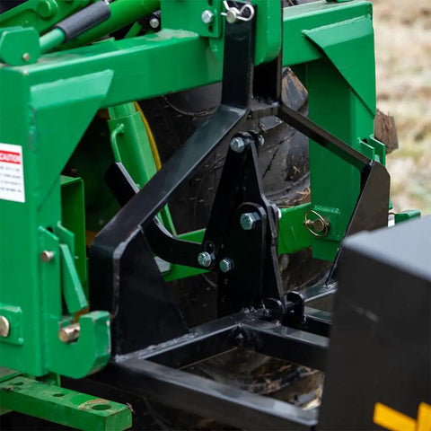 Close-up of 3 Point 10 Cu Ft Dump Box with quick hitch on Category 1 tractor showing rear self dumping mechanism.