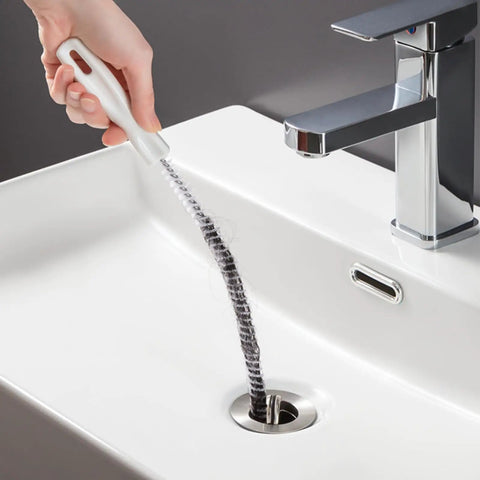 Heavy Duty Flexible Drain Snake Brush For Kicking Clogged Sink And Tub Pipes Clear, reusable tool clearing hair in sink.