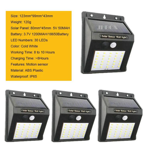 Four Solar Motion Sensor Outdoor Lights 30 LED 4 Pack With Motion Activated Security Lighting displayed front and side in black.