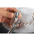 Close-up of Body Repair Spot Weld Kit With Dent Puller, 800VA Spot Welder, Stud Gun Set tool tip held by a hand