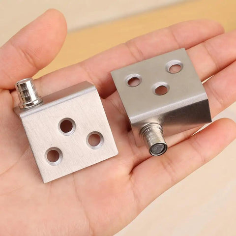Easy Install Stainless Steel Hidden Right Angle Hinge For Cupboard And Cabinet Doors Rotatable With Screws Includes 2 Pack Of Hardware Fittings In Silver Finish 35 By 32.5 Mm, shown resting on an open palm.