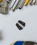 Jewedco Replacement Crimping Dies For Wire Crimper Machine high carbon steel dies among various tools on a tabletop