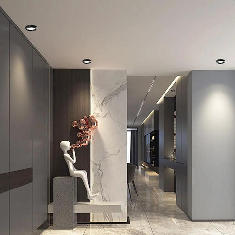 XYIANG 4.3 Inch Led Recessed Lighting with Black/Gold Wall Washer Trim in a stylish modern hallway.