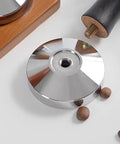 Close-up of Stainless Steel Espresso Tamper With Pressure Regulator for 51mm 54mm 58mm portafilters on table.