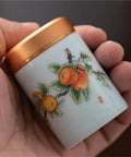 Top Tier Ceramic Food Storage Jars Set Of Twelve With Airtight Snap Lids For Spices Tea And Coffee Beans, Handheld design with orange fruit decoration.