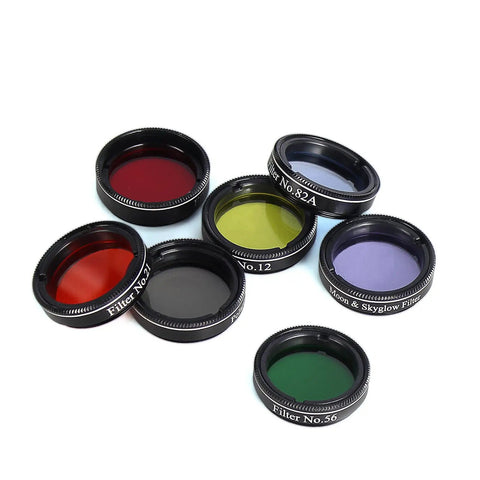 Seven filters from the 1.25 Inch Telescope Eyepiece And Filter Kit with Five Plossl Eyepieces and a 2X Barlow, different colors.