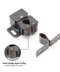 10 Pack Double Roller Cabinet Latches With Spear Strike For Cupboard Closet Door Easy Install Secure Closure Antique Bronze Finish Built Tough For Cabinets And Dressers Smooth Quiet Action Durable Steel Construction, showing a close-up of the latches with nylon pulley.