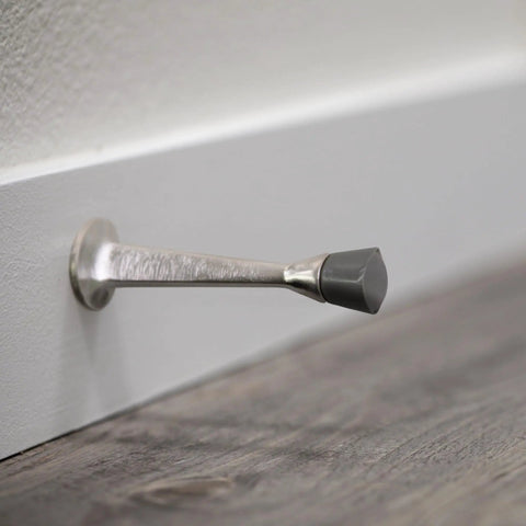 Door Stop Wall Protector With Rubber Tip Satin Nickel Solid Steel Cast Door Stoppers Ten Pack For Home Protection And Wall Damage Prevention Easy Install And No More Dings From Slamming Doors installed on wall