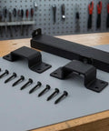 Heavy Duty Sliding Bar Gate Latch With Padlock Hole In Matte Black Metal For Outdoor Garden Sheds And Fences Built Tough With Straight Up Secure Locking Action That Is The Real Deal, parts and screws displayed.