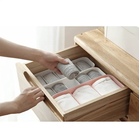 Keep Your Closet Chill With This Four Piece Sock And Underwear Storage Box Featuring Smooth Slide Compartments For Taming Piles And Sorting Gear With Ease showing organized gray socks in a drawer.