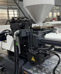 Heavy Duty Hydraulic Automatic Injection Molding Rig For Crafting Plastic Chairs And Household Wares That Devours Pp Pe Abs Pvc Pet Pc Resin Without Skipping A Beat close-up of hydraulic components and material hopper