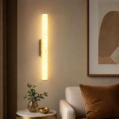 JCQASRT 19.69 in Modern Wall Sconce on a wall, featuring a warm resin shade and polished brass base in cozy living room setting.