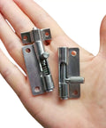 Hella Durable 304 Stainless Steel Spring Loaded Latches For Cabinet Doors With Telescopic Gun Hinge Hardware held in hand