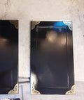 Two Point Five Inch Four Piece Antique Brass Corner Brackets For Furniture Edge Guarding And Vintage Home Decor Makeover featuring shiny brass accents on black furniture edges.