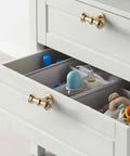 Open dresser with Dope 10 Pack Brushed Brass Cabinet Knobs For Kitchen Cabinets And Dressers, gold tone hardware visible