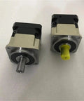 High Performance Hard Tooth Planetary Gear Reducer Delivering Rock Solid Torque Conversion And Absolute Zero Slop Action For Heavy Duty Speed Reduction Projects side view of two gearbox units with metal and plastic components.