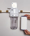Whole House Water Filter Replacement For Home Filtration System NSF Certified To Reduce Chlorine Taste And Odor, Sediment, Rust And Impurities 10 Inch 4.5 Inch Filter Compatible With GXWH40L GXWH30C GXWH35F GXWH38F GNQH38S Replace Every 3 Months shown with filter housing installed on pipes.