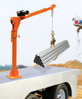 Heavy Duty 1100 Lb Truck Bed Crane Hoist With Electric Winch lifting steel pipes on a pickup truck bed.
