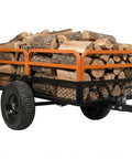 Beast 1500Lb Heavy Duty Steel Dump Cart loaded with firewood, featuring all-terrain tires and removable sides for lawn work