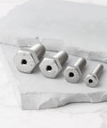 Pro Grade 4 Piece Heavy Duty Stainless Steel Busted Stud Drill Guide Kit M6 M8 M10 M12 screws displayed on a marble surface.