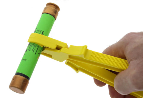 Ideal Industries 34-016 Large Fuse Puller For Heavy Duty Electrical Work in use, removing green 9/16 to 1 inch fuse with yellow grip.