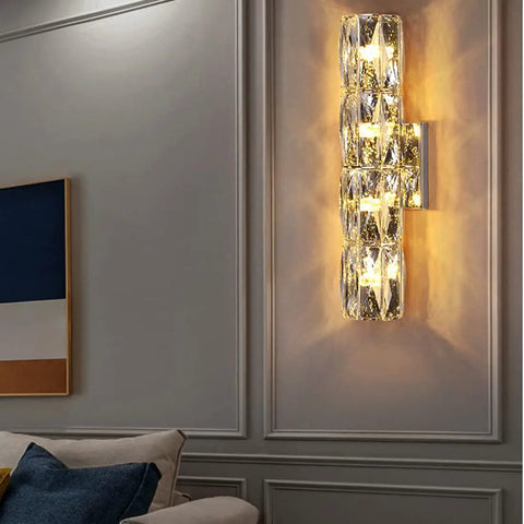 Gold Crystal LED Wall Light Sconce Dope Modern Elegant Wall Mount Lamp illuminating living room with crystal accents.