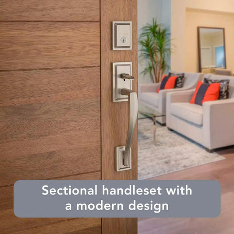 Front Entry Handleset With Interior Lever And SmartKey Rekey Technology, Microban Protection, Satin Nickel Finish shown on wooden door