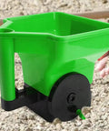Green portable lightweight lawn care tool, 3L handheld fertilizer spreader, for lawns and gardens, adjustable broadcast spreader.