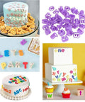 Top Shelf 114 Piece Cake Decorating Kit Loaded With Fondant Plunger Cutters Sugar Craft Molds with playful letter designs on cakes.