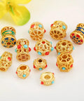 Grab These Dope Hollow Transfer Beads For Your Next DIY Jewelry Build And Stack Up Some Fire Sand Gold Spacer Charms Featuring A Sleek Baking Lacquer Coating Perfect For Chilling With Bracelets Necklaces Earrings And Custom Keychain Projects - assorted gold spacer beads with turquoise and red accents, sized 10.5 x 8.5mm
