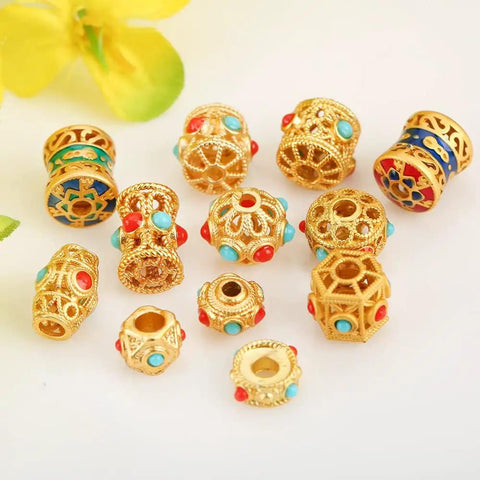 Grab These Dope Hollow Transfer Beads For Your Next DIY Jewelry Build And Stack Up Some Fire Sand Gold Spacer Charms Featuring A Sleek Baking Lacquer Coating Perfect For Chilling With Bracelets Necklaces Earrings And Custom Keychain Projects - assorted gold spacer beads with turquoise and red accents, sized 10.5 x 8.5mm