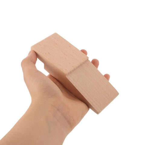 Hand holding Two Pack Wood Bench Pin Block For Jewelry Workbench Clamp With Smooth Polishing Surface And Adjustable Support