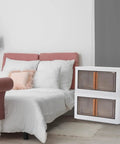 4 Pack Clear Amber Plastic Storage Bins With Secure Lids Stackable Collapsible Closet Organizers Heavy Duty Pressure Resistant Stacking Crates 72L Haul Size stylishly placed by a bed.