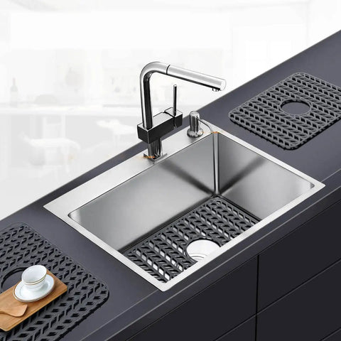 Gray silicone sink mat grid in kitchen sink, 18.2 x 12.5 inches, protects glassware and stainless surfaces, fits curved edges.