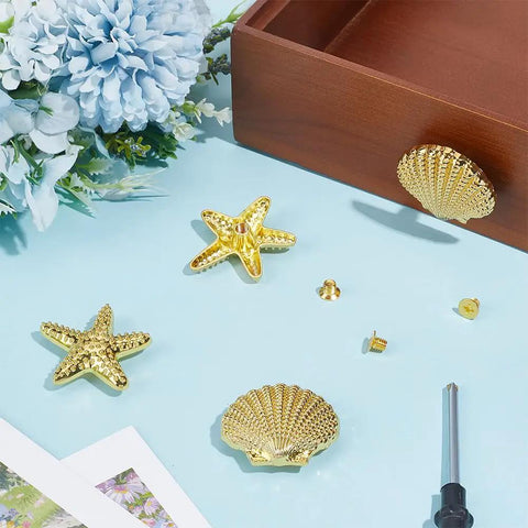 Slap These Killer Gold Cabinet Knobs Onto Your Dresser Or Vanity For An Instant Coastal Vibe Upgrade This Twelve Piece Hardware Set Features detailed starfish and seashell designs.