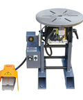 Built Like A Tank Welding Positioner Offering 771 Pound Horizontal Capacity And No Hassle 110V Single Phase Rotation in gray with foot pedal.