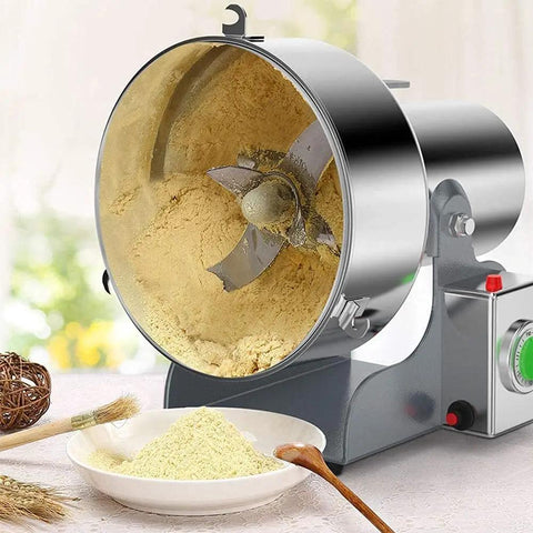 Electric Grain Mill Grinder In Stainless Steel 304 With Auto Time Switch Easy Pour Inner Wall And Heavy Duty Construction Ideal For Grinding Coffee Beans Wheat Corn Oats Rice And Other Dry Goods At Home Or Small Shops showing open grain chamber filled with ground flour