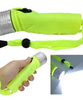 Beefy 4 AA Battery Diving Flashlight With LED Underwater Light, aluminum body, compact dive torch in hand, strap attached, emitting light