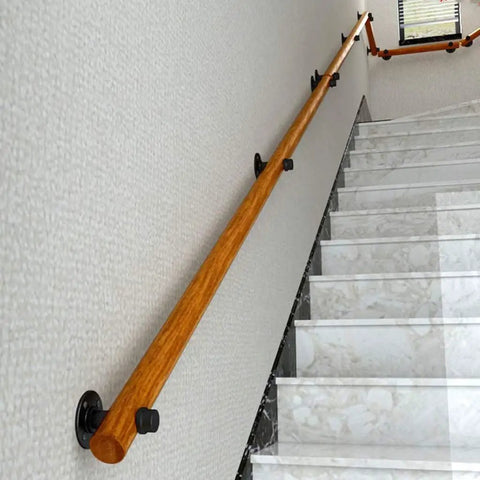 Top Shelf Solid Wood Stair Banister Handrail With Anti Slip Pine Railing mounted on wall alongside marble staircase.