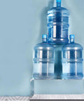 Clear Acrylic Display Case For 75331 Razor Crown Airship Model supporting heavy water bottles, demonstrating strength and stability.