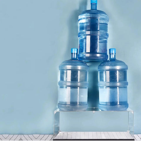 Clear Acrylic Display Case For 75331 Razor Crown Airship Model supporting heavy water bottles, demonstrating strength and stability.