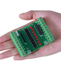 Person holding 8 Channel Optocoupler Isolation Board For DC 3.3V To 5V Inputs, NPN PNP High Low Level Output, Signal Converter